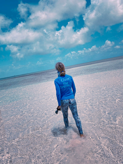 Girl in sea with Deep Sea Contour Leggings